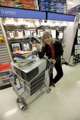 Digital Life reporter Gillian Shaw finds a one-stop solution to archiving photos digitally at London Drugs. (Mark Yuen/Vancouver Sun) [PNG Merlin Archive]