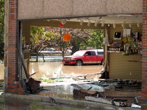 A former gift shop, with a truck that was abandoned, on June 22, 2013, was totally wiped out by the raging flood waters of the Highwood River in High RIver.