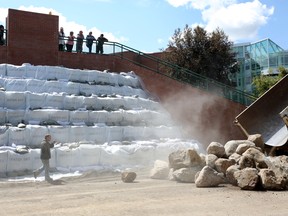 Workers prepare City Hall in Medicine Hat, Alberta on June 22, 2013 for the flood.