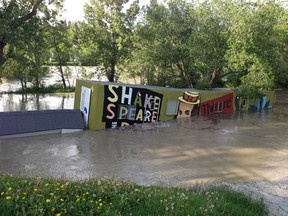 Floodwaters rise around the Shakespeare in the Park trailer on Prince's Island on Thursday, June 20.