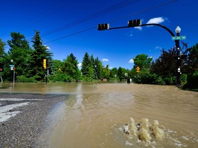 30 ave SW quickly filling with water. Photo by John Orr.