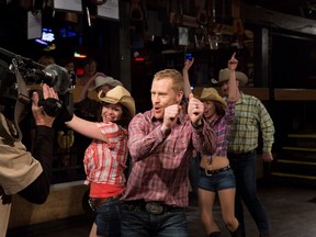 Host Jon Montgomery gets his cowboy on while filming a segment at Ranchman's for The Amazing Race Canada.