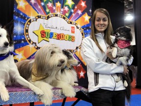 Trainer Romy Dupal-Demers poses with four of her dogs that are in the SuperDogs show at the Calgary Stampede.