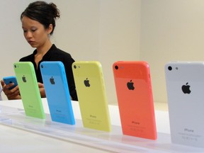 The new lower-cost iPhone 5C will debut in a set of lively colours. Apple unveiled two new iPhones on Tuesday in its bid to expand its share of the smartphone marke.