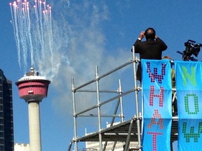 Mayor Naheed Nenshi watches as fireworks erupt from the top of the Calgary Tower as part of the opening ceremonies of Beakerhead, a festival celebrating science, engineering and the arts.