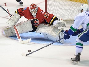 Vancouver Canuck prospect #46 Niklas Jensen gets a shot off against Calgary Flame prospect #37 Joni Ortio, September 6th, during an evening game at the South Okanagan Event Centre in Penticton.