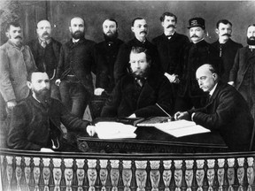 Calgary's first town council, 1884. Mayor George Murdoch is seated at left; Ald. Dale Hodges is standing, third from left