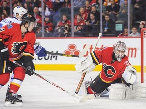 Karri Ramo #31 of the Calgary Flames makes a glove save. (Photo by Derek Leung/Getty Images)