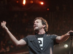 Eddie Vedder of Pearl Jam takes centre stage at their Saddledome show in Calgary Monday night. Photo by Ted Rhodes, Calgary Herald.