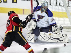 Calgary Flames Niklas Hagman against St. Louis Blues goalie Ben Bishop  n NHL action against St. Louis Blues at Scotiabank Saddledome Sunday. February 27, 2011