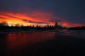 The sun has set on another year. A chinook arch and a spectacular sunset combined for a beautiful evening with the Calgary skyline along the Bow River on Nov. 26, 2013. (Gavin Young/Calgary Herald) (For City story by None/Standalone)