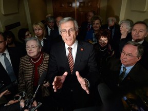 Senate opposition leader James Cowan, flanked by the New Power Generation. Canadian Press