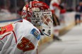 Joni Ortio #37 of the Calgary Flames during warm ups before taking on the New York Islanders at Nassau Coliseum on February 6.