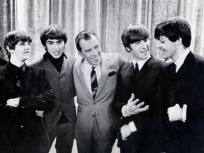 The Beatles with Ed Sullivan in 1964. UPI photo, Herald archives.