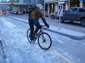 A cyclist uses the new downtown bike lanes on 7th street S.W.