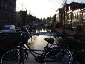 bike parked along canal holland