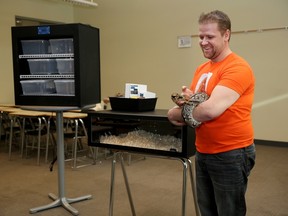 Greg West with a ground boa, makes his pitch in Calgary to appear on Dragons' Den.