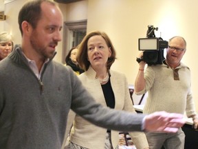 Premier Alison Redford arrives at the Clarion Hotel on Saturday to meet with the Progressive Conservative party's executive.