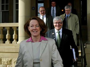 Alberta Premier Alison Redford and members of her caucus leave Government House in Edmonton on Monday.