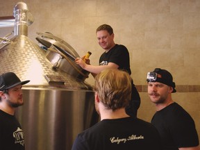 Bear Hill Brewing recently started making beer at its new Calgary brewpub location in Calgary, which will become Last Best Brewing and Distilling. (L-R) Kyle Smythe, head brewer at Wood Buffalo Brewing in Fort McMurray; Bear Hill owner Brett Ireland; brewery operations manager Phil Brian; owner Socrates Korogonas.