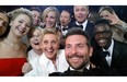 This image released by Ellen DeGeneres shows actors front row from left, Jared Leto, Jennifer Lawrence, Meryl Streep, Ellen DeGeneres, Bradley Cooper, Peter Nyong’o Jr., and, second row, from left, Channing Tatum, Julia Roberts, Kevin Spacey, Brad Pitt, Lupita Nyong’o and Angelina Jolie as they pose for a "selfie" portrait on a cell phone during the Oscars at the Dolby Theatre on Sunday, March 2, 2014, in Los Angeles.