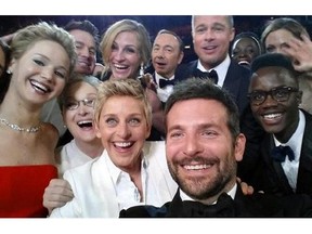 This image released by Ellen DeGeneres shows actors front row from left, Jared Leto, Jennifer Lawrence, Meryl Streep, Ellen DeGeneres, Bradley Cooper, Peter Nyong’o Jr., and, second row, from left, Channing Tatum, Julia Roberts, Kevin Spacey, Brad Pitt, Lupita Nyong’o and Angelina Jolie as they pose for a "selfie" portrait on a cell phone during the Oscars at the Dolby Theatre on Sunday, March 2, 2014, in Los Angeles.