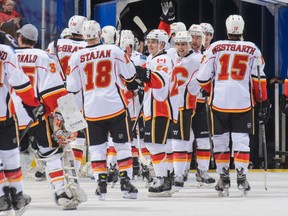 The Calgary Flames celebrate after trouncing the Edmonton Oilers 8-1.