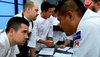 The men’s team, including captain Rich Francis and Michael Robbins, work out their menu. Photo courtesy Top Chef Canada.