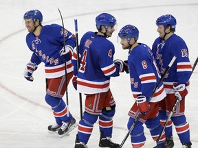 Rangers celebrate after a goal in 3-1 victory over Philadelphia.
