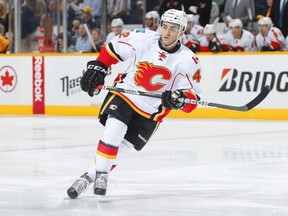 Mark Cundari is set to make his first NHL appearance of the season when the Flames visit the New Jersey Devils.