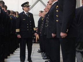 Fire Chief Bruce Burrell inspects new recruits, 2010. Ted Rhodes/Calgary Herald