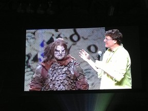 A Calgary contest winner receives an Orc makeover from Sir Richard Taylor, co-founder and creative director of Weta Workshop. The transformation took place at the Calgary Comic & Entertainment Expo on Friday