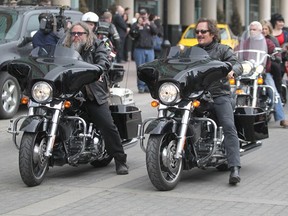 Sons of Anarchy actors Mark Boone Jr., left, and Kim Coates take part in POW!: The Parade of Wonders for the start of the Calgary Comic & Entertainment Expo on Friday.