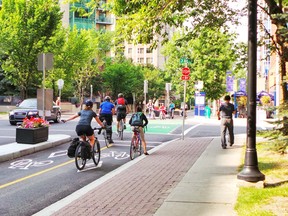 Cyclists on the 7th Street Cycle Track in downtown Calgary.