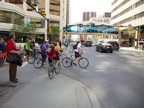 Cyclists trying to negotiate around the closure of the 7th Street S.W. cycle track.