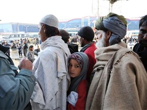 Afghans line up for food aid in Kabul. Doctors have said they are starting to see more cases of malnutrition in the Afghan capital and the UN says that is true in several provinces.