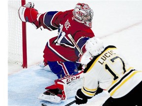 Montreal goalie Carey Price makes a save against Boston's Milan Lucic during playoff action last week. Reader says Lucic's nasty comments during post-game handshakes reflect badly on him.