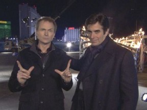 The Amazing Race All-Stars host Phil Keoghan, left, poses with illusionist David Copperfield during a challenge on Sunday's finale of The Amazing Race All-Stars.