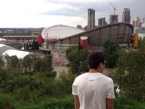 Calgary Hitmen right winger Pasha Padakin takes in a view of the flooded Saddledome.