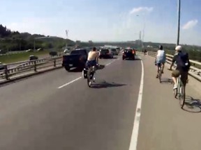 Cyclists ride on Crowchild Trail during the Crowbomb.