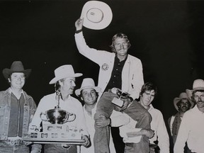 Tom Glass, centre, celebrates an early 1980s chuckwagon win. The story of the Glass family (which has now produced four generations of prize-winning chuckwagon drivers) is a featured component in the new Grandstand Show at the 2014 Calgary Stampede. Calgary Herald archive photo.