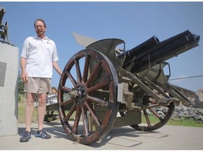 Ian McKenzie, VP of the Crowsnest Heritage Initiative, with the three guns that stand as the memorial to First World War veterans from the area, in Crowsnest Pass, Alberta.
