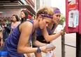 Jackie, left, and Laura look for clues as The Amazing Race Canada swings through Hong Kong.