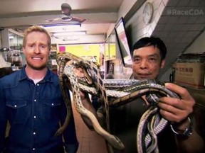 The Amazing Race Canada host Jon Montgomery pulls an Indiana Jones when confronted with the still-wriggling specialties of the house at a restaurant in Hong Kong.