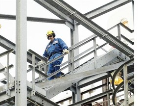 A Shell Canada worker descends the stairs at the Scotford refinery east of Edmonton where the company is working on carbon capture.