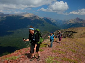 Krystal Northey, Ruth Midgley and Herald reporter Colette Derworiz walk along Akamina Ridge in the Flathead.