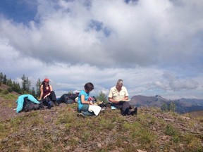 Krystal Northey, Ruth Midgley and Harvey Locke take a break on a ridge before heading into Grizzly Gulch.