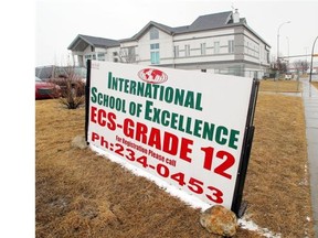 Top administrators at the International School of Excellence, which was ordered shut by Education Minister Jeff Johnson in May following a financial audit, were paid $55,000 over the past five years from a society that fundraises for the private school.