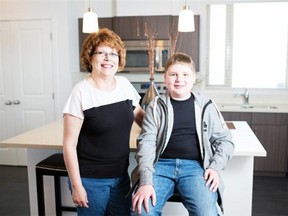 Adrian Shellard/For Special Projects 
 Cindy Walsh and her son Mathieu are moving into a unit at the Street Towns development that Homes by Avi is building in Legacy.