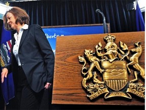 Alberta Premier Alison Redford walks away from the podium after a short news conference at the legislature on Wednesday announcing that she’s paying back the cost of her South Africa trip.